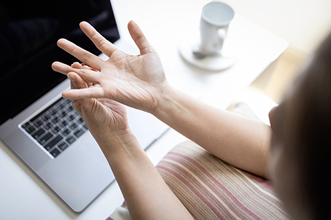 woman holding fingers
