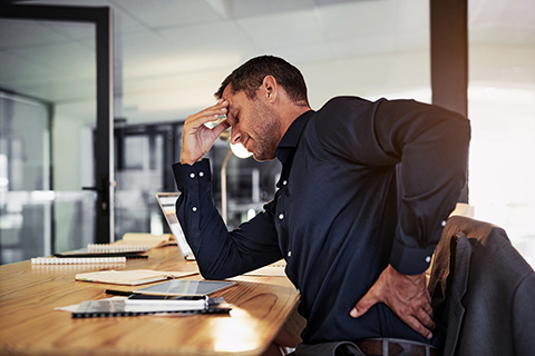 stressed man with back pain