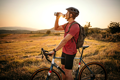 cyclist drinking water